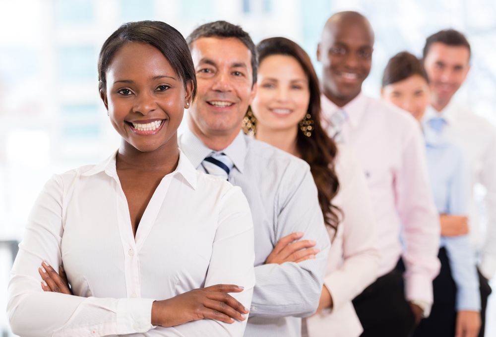 Successful woman leading a business group and looking happy